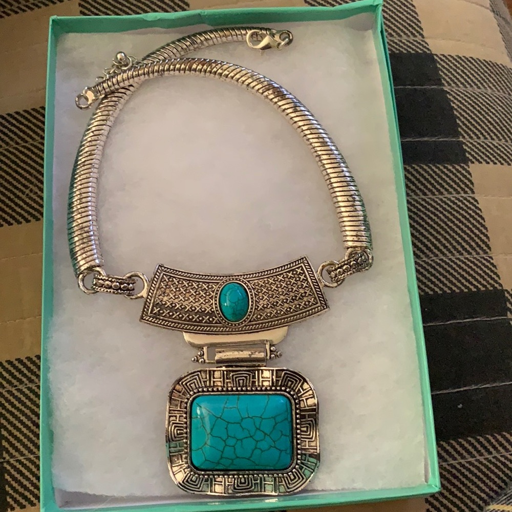 A fake silver and turquoise blue necklace